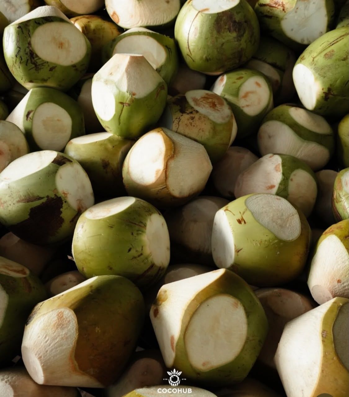 Peeled young coconuts piled up